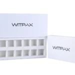 An open white rectangular box reveals a custom multi-compartment organizer inside, with a separate section of the packaging displayed next to it.
