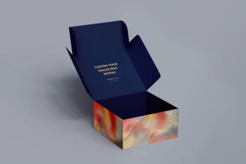 We are a manufacturer of custom box packaging. Please revise the following description to align with packaging terms and ensure it does not depict any text on the packaging:

"Open custom mailer box featuring a dark blue lid, complemented by a colorful abstract wave pattern along the sides, reminiscent of an aurora.