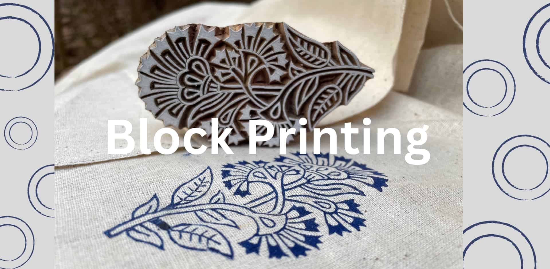 Block print of floral design on fabric with wooden stamp nearby.
