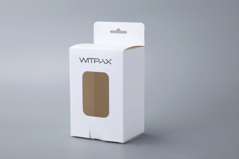Folding carton with window